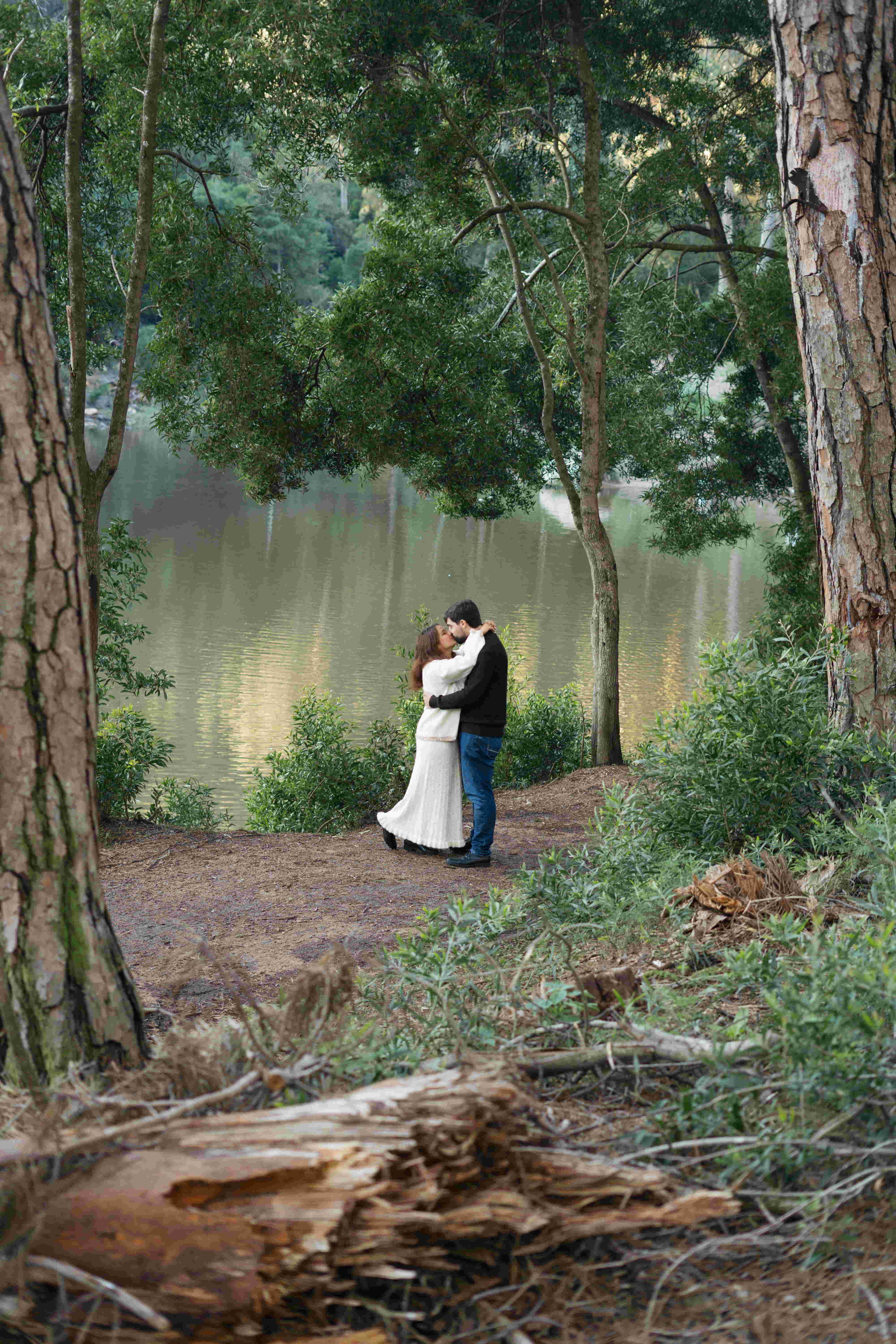 Ricardo and Sharmila smiling together, with a scenic background